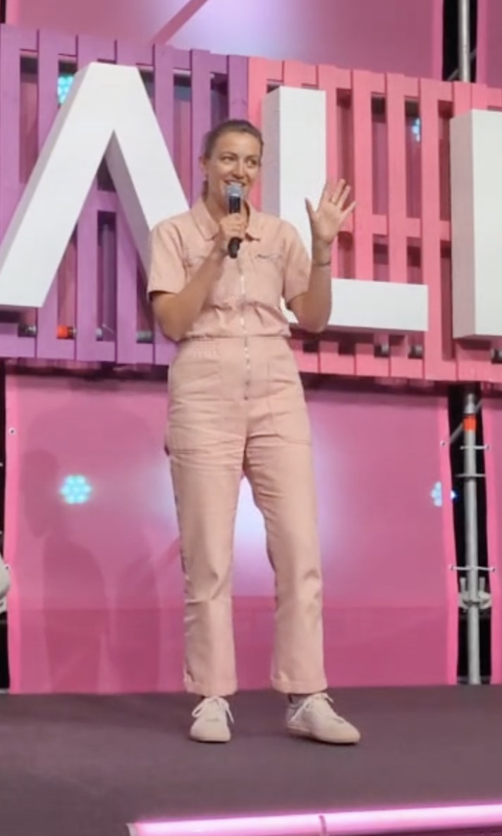 Maeve founder Phoebe pitching on stage at ShopTalk